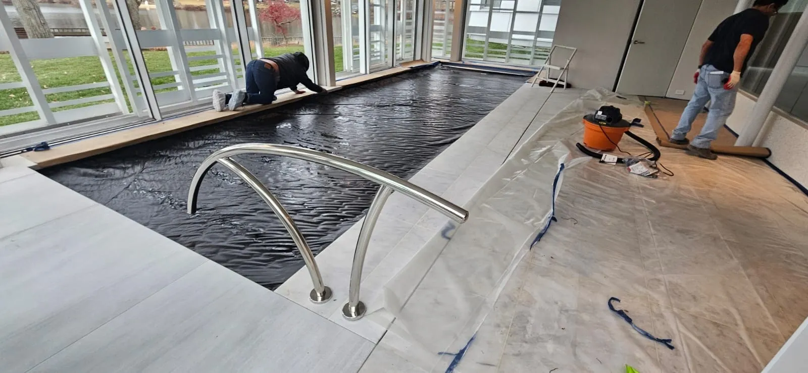 Indoor pool installation with stainless handrail