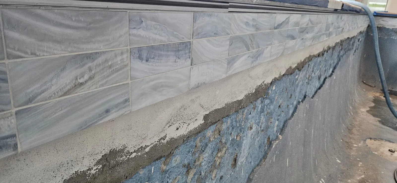 Swimming pool tile repair and cement patch